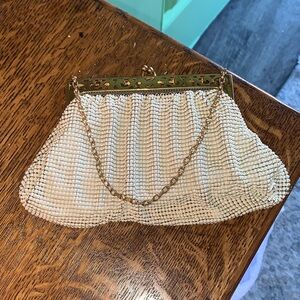 Vintage Whiting & Davis gold mesh purse with a purple lining
